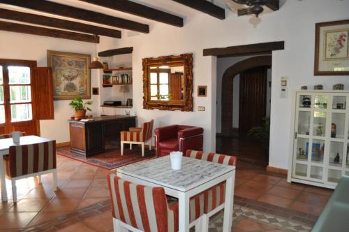 a living room with a table and chairs at Casa Silca in Marbella