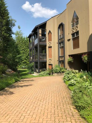 a building with a brick road in front of it at The Ironwood on Blueberry Hill in Whistler