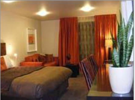 En eller flere senger på et rom på Terra Vive Suites & Apartments