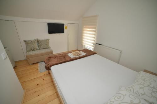 Katil atau katil-katil dalam bilik di Apartmani MV