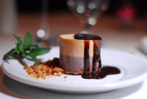 a piece of dessert on a plate on a table at Hotel Solaris in São Miguel dʼOeste