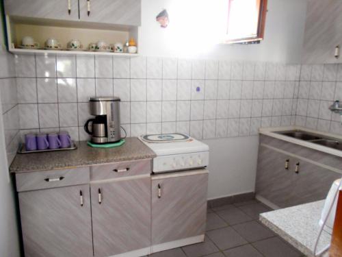 Kuchyň nebo kuchyňský kout v ubytování Árpád Panzió