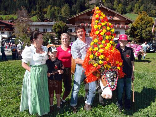 a group of people standing next to a bunch of flowers at Landgasthof Dorferwirt in Oberau