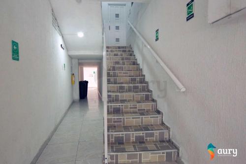 a staircase in a building with stone steps at Apartamentos Aury in San Andrés