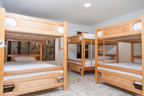 a group of bunk beds in a room at Les Balcons Hostel in Popayan