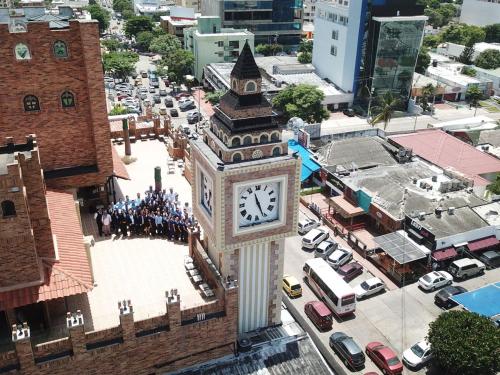 a large clock tower in the middle of a city at Hotel Windsor Barranquilla in Barranquilla