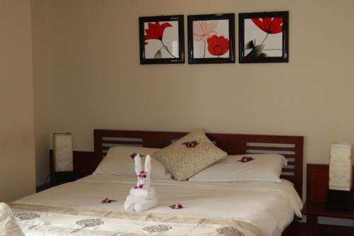 Ένα ή περισσότερα κρεβάτια σε δωμάτιο στο Long Life Riverside Hotel