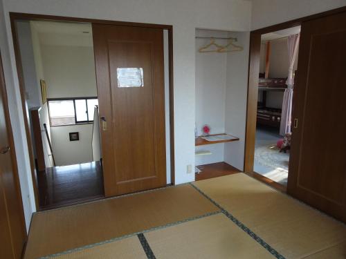 Postel nebo postele na pokoji v ubytování Guesthouse Gifu SUAI