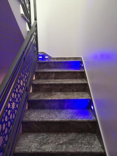 a set of stairs with blue lights on them at My Home Mirelft in Mirleft
