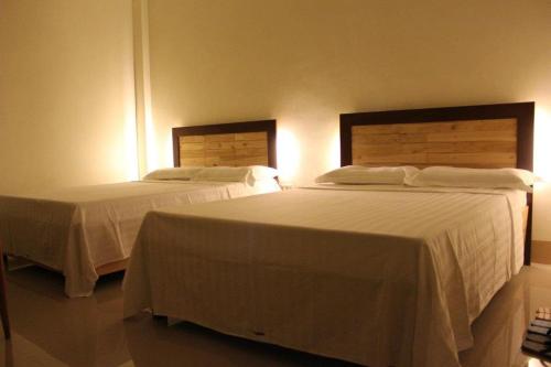 Una cama o camas en una habitación de DaHome Pension
