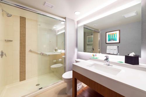 a bathroom with a sink and a shower and a toilet at Hyatt Place Nashville Downtown in Nashville