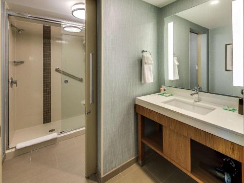 a bathroom with a sink and a shower at Hyatt Place Edmonton West in Edmonton