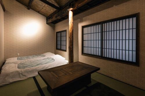 Postel nebo postele na pokoji v ubytování Hazuki Kyoto
