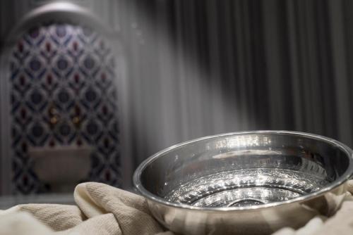a silver bowl sitting on top of a table at Mirart Hotel Boutique & SPA Yalova in Yalova