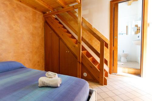 Postel nebo postele na pokoji v ubytování Agriturismo Il Gelsomino Ritrovato