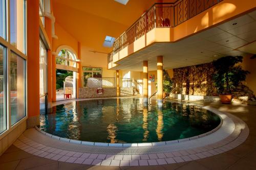 an indoor swimming pool in a building with a building at Résidence les Tourelles in Sainte-Maxime