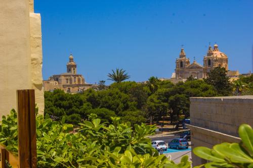 a view of a city with buildings and trees at Casa Azzopardi Suites in Rabat