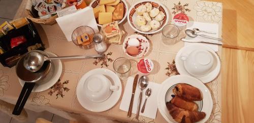 a table topped with plates and bowls of food at La Calla in Monghidoro