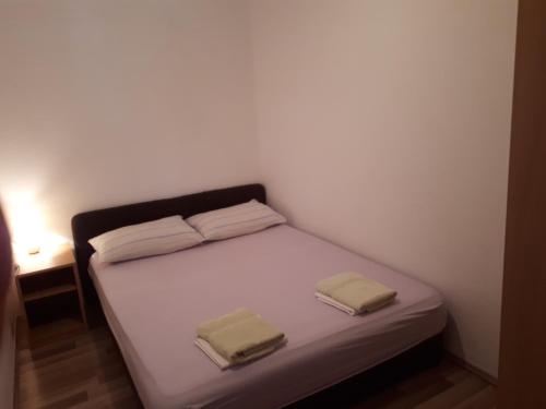 Säng eller sängar i ett rum på Apartman Miro
