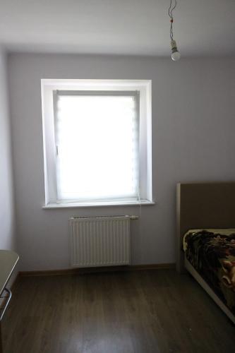 a room with a large window and a bed at Willa Mare Nostrum Gdynia - pokoje gościnne in Gdynia