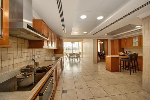 a kitchen with pots and pans on the counter at J5 Villas Holiday Homes Barsha Gardens in Dubai