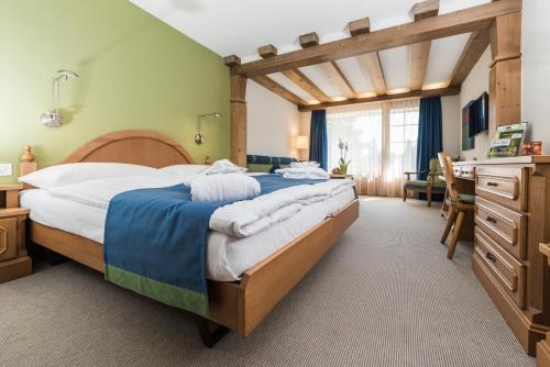 Postel nebo postele na pokoji v ubytování Soldanella by Hotel Adula