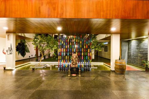 a room with a large display of colorful bottles at Regenta Resort Soma Vine Village Nashik in Nashik