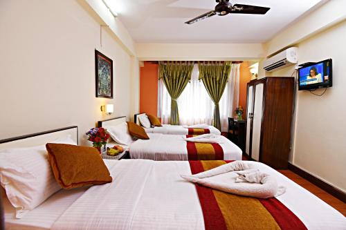 Postel nebo postele na pokoji v ubytování Hotel Pleasure Home