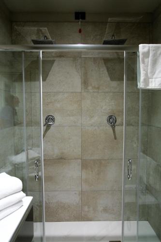 a shower with a glass door in a bathroom at Il Convento Case Vacanze in Rapallo