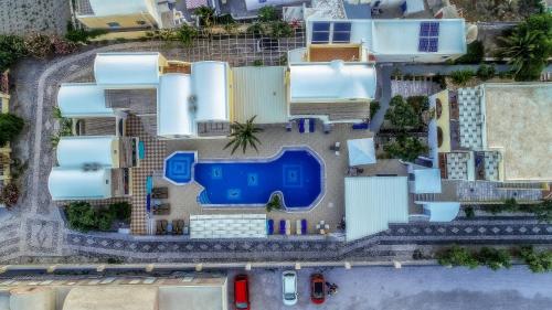 an overhead view of a building with a pool at Villa Eleftheria in Perivolos
