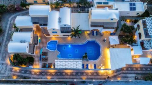 an aerial view of a building with a swimming pool at Villa Eleftheria in Perivolos