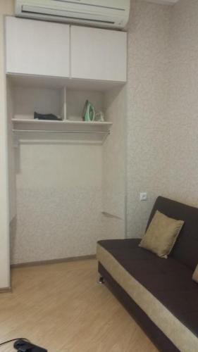 a bedroom with a bed and a white wall at Joniskera in Tbilisi City
