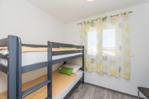 Posteľ alebo postele v izbe v ubytovaní Apartments Janice