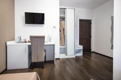 a white room with a desk and a mirror at Gorgeous Villa in Cluj-Napoca