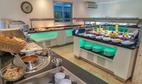a buffet line with many different types of food at Kleopatra Celine Hotel in Alanya