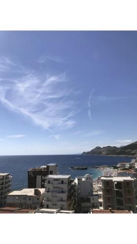 a view of a city and the ocean with buildings at Apartmani Belma in Dobra Voda