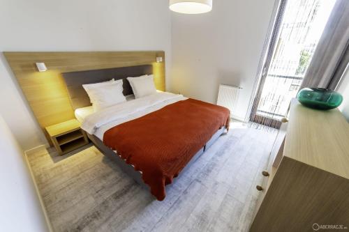 Postel nebo postele na pokoji v ubytování Granary Island Apartment