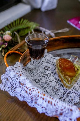 a cup of tea and a piece of bread on a table at Filoxenia- Drakia in Drakeia