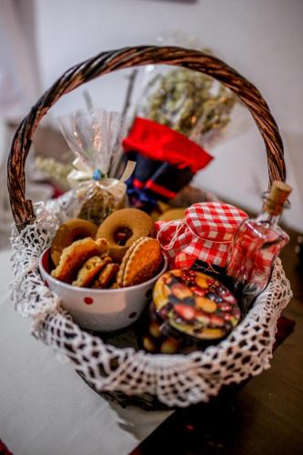 a basket of cookies and other snacks on a table at Filoxenia- Drakia in Drakeia