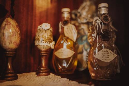 a group ofempty bottles sitting on a table at Filoxenia- Drakia in Drakeia