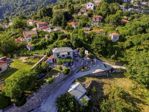 an aerial view of a house in a village at Filoxenia- Drakia in Drakeia