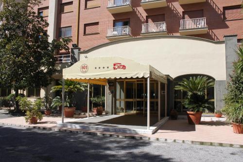a building with an awning in front of it at 501 Hotel in Vibo Valentia
