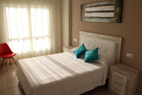 Postel nebo postele na pokoji v ubytování Rivera Del Tirón Apartamentos