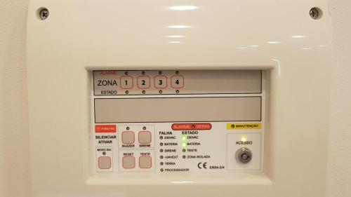 a microwave oven with lots of controls on it at Black House in Praia da Vitória