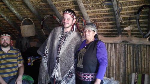 a man and a woman standing next to each other at Hostal Mahuida in Pucón