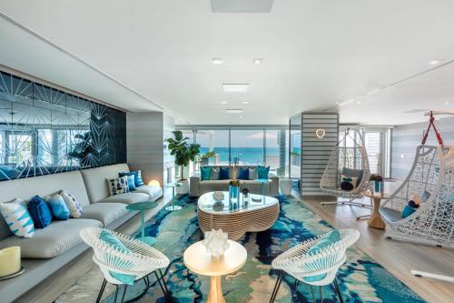 a living room filled with furniture and a large window at Condado Ocean Club in San Juan