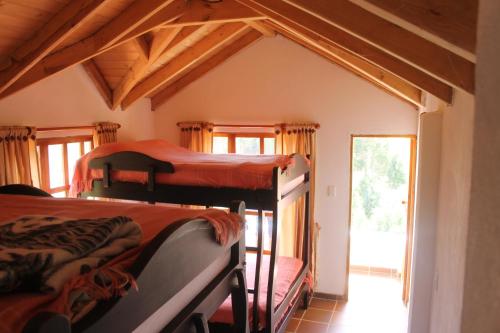 Een bed of bedden in een kamer bij Alcalá Cabañas Campestres