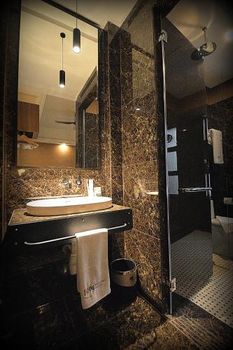 a bathroom with a sink and a mirror at 1969 Business Suites Bandar Botani, Ipoh in Ipoh