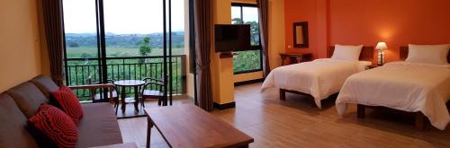 Postel nebo postele na pokoji v ubytování Baan Sakuna Hotel