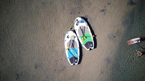 an overhead view of two surfboards on the beach at The Jervis Bay Villas in Vincentia